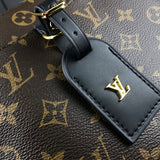 Styled lifestyle shot of classic sleek women's handbag – women's statement bag