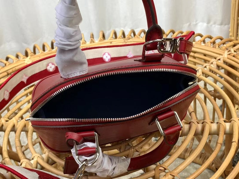 Front view of polished classic women's handbag – women's statement bag