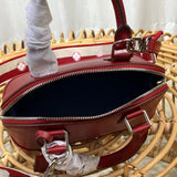 Front view of polished classic women's handbag – women's statement bag