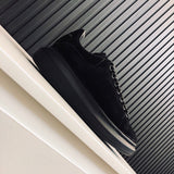 Alexander McQueen tonal black luxury sneakers view 5 classic court silhouette