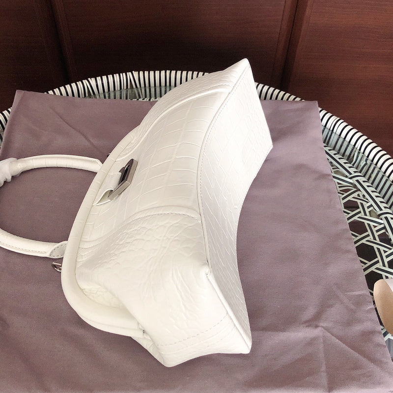 Side profile of elevated modern women's handbag – women's statement bag