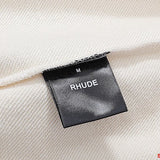 Close-up detail shot of Rhude luxury clothing with runway-inspired design