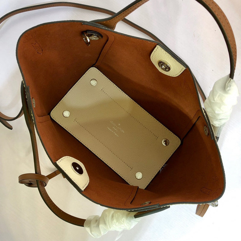 Handle and strap detail of signature elevated women's handbag – women's statement bag
