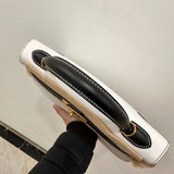 Side view of contemporary structured handbag