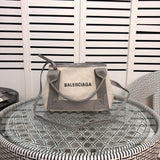 Front view of signature polished women's handbag – women's luxury handbag