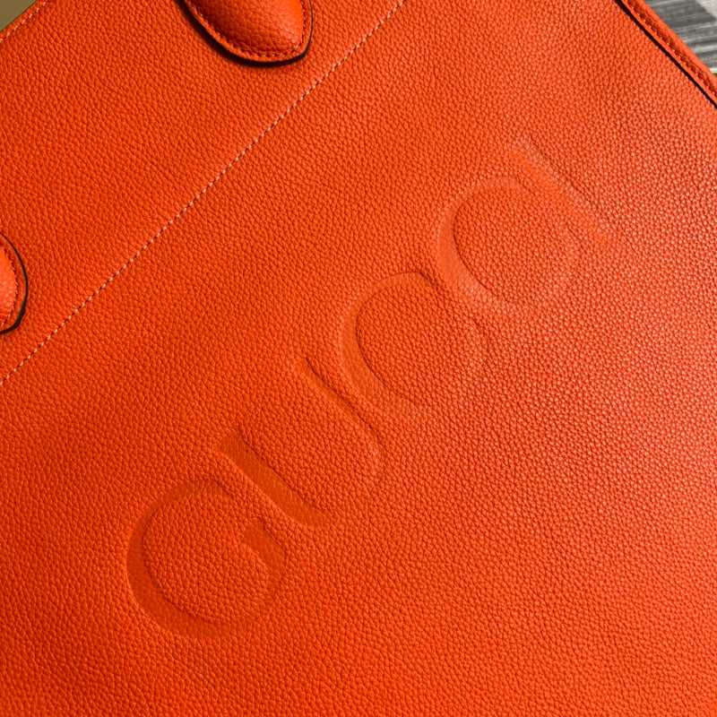 Side profile of refined structured women's handbag – women's statement bag