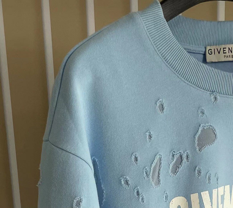 Flat lay presentation of Givenchy luxury clothing with logo-detail design