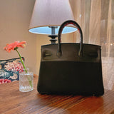 Side view of fluid structured handbag