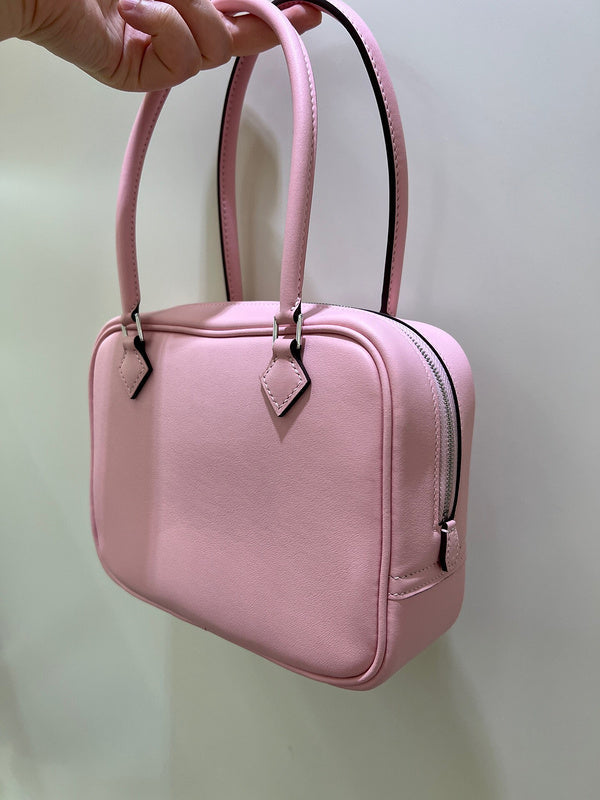 Side view of minimalist structured handbag