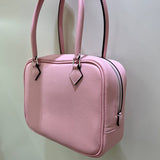 Side view of minimalist structured handbag
