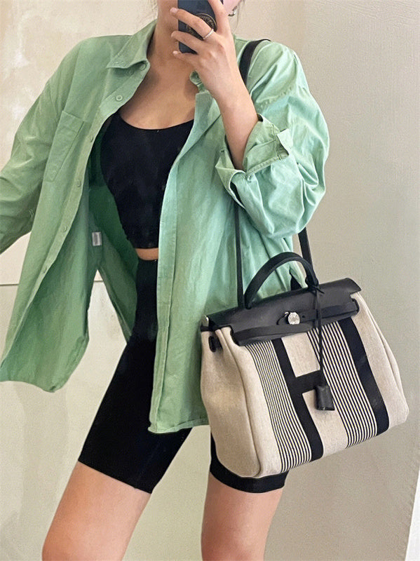 Side view of minimalist structured handbag