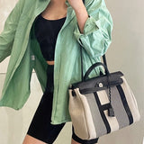 Side view of minimalist structured handbag