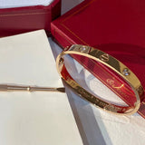 Side view of Cartier unisex jewelry piece