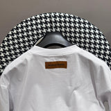 Close-up detail shot of Louis Vuitton cotton t-shirt with logo-detail design