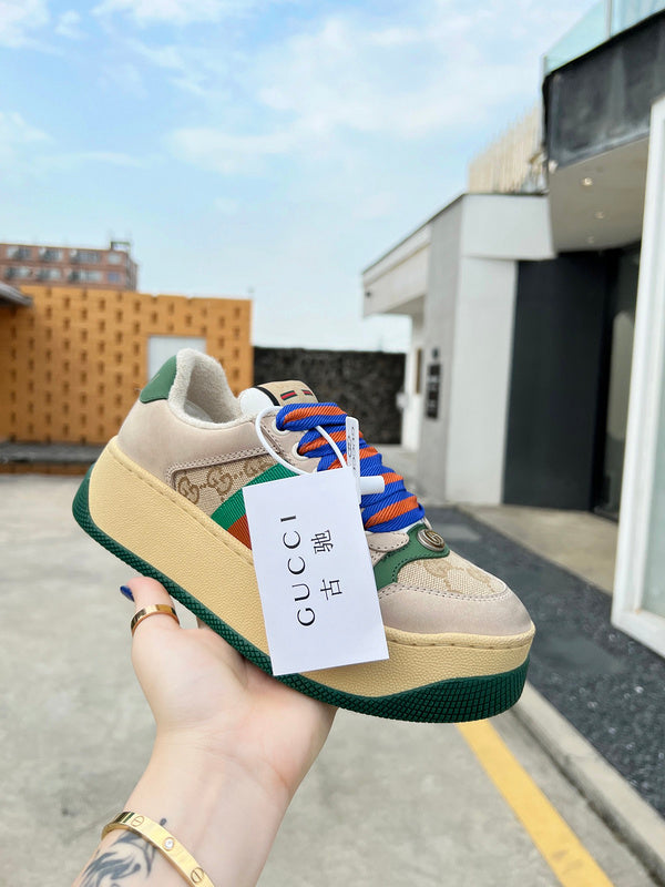 Side profile of Gucci crisp white sneakers heritage-inspired look