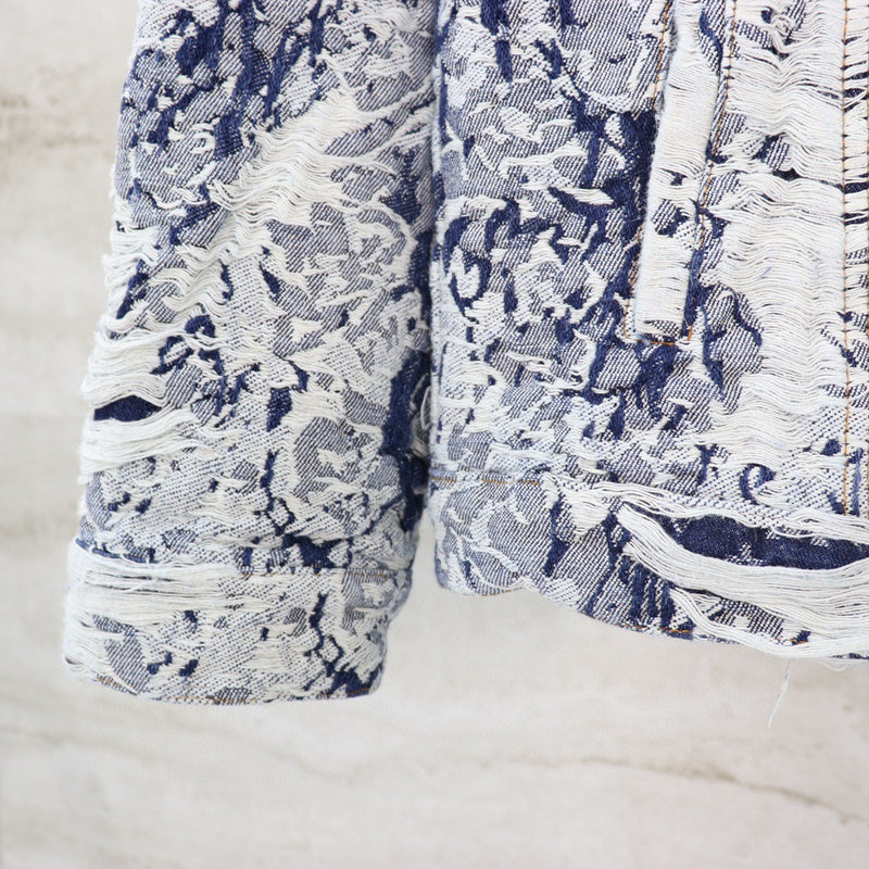 Close-up detail shot of Louis Vuitton luxury clothing with relaxed-fit cut