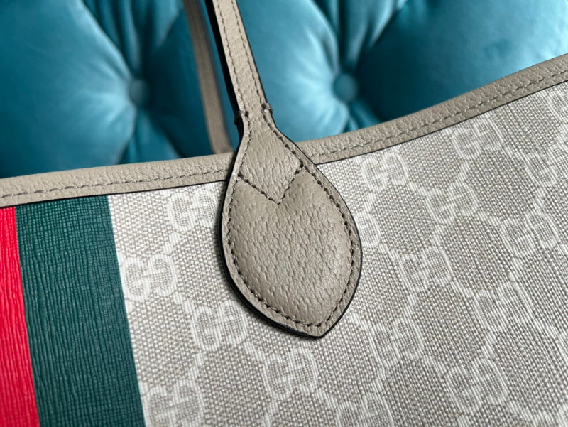 Handle and strap detail of modern signature women's handbag – women's designer-style accessory