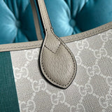 Handle and strap detail of modern signature women's handbag – women's designer-style accessory