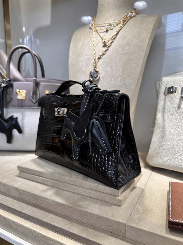  Graceful top-handle bag carried on shoulder