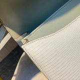 Side view of refined structured handbag