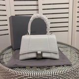 Side profile of elevated signature women's handbag – women's designer-style accessory