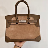  polished top-handle bag styled with outfit