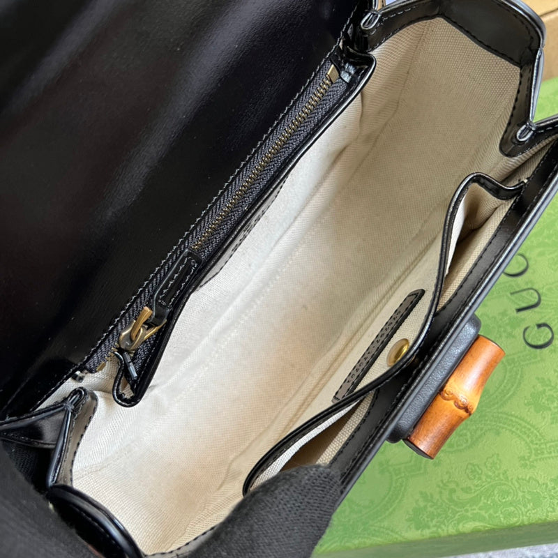 Side view of poised structured handbag