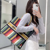 Styled lifestyle shot of modern statement women's handbag – women's luxury accessory