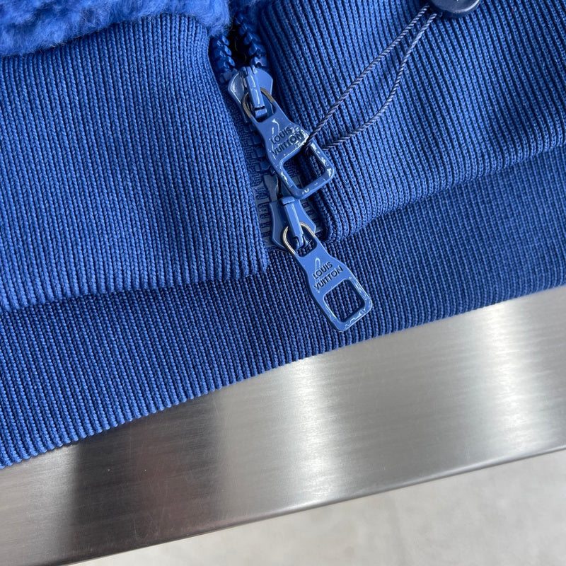 Flat lay presentation of Louis Vuitton luxury clothing with contemporary cut