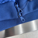 Flat lay presentation of Louis Vuitton luxury clothing with contemporary cut