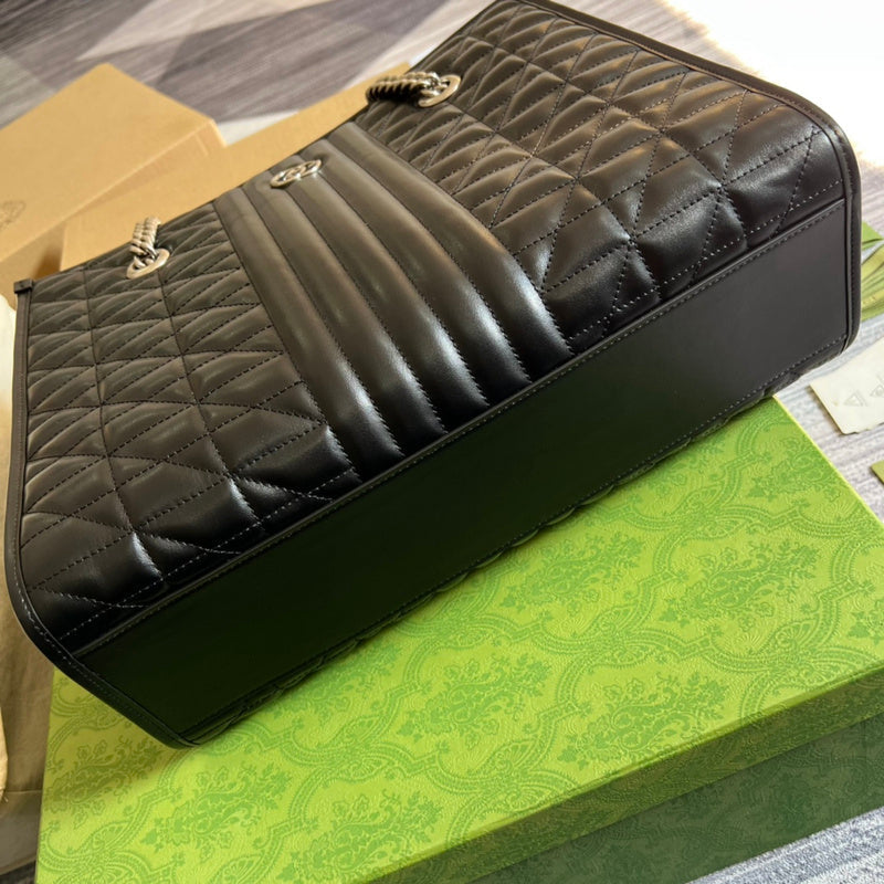 Styled lifestyle shot of elevated premium women's handbag – women's luxury handbag