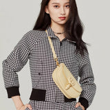 Close-up detail of refined chic women's handbag – women's designer-style accessory
