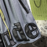 Flat lay presentation of Rhude luxury clothing with monogram-inspired silhouette