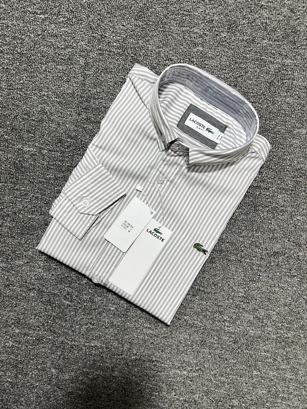Close-up detail shot of Lacoste luxury clothing with monogram-inspired silhouette