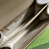 Side profile of signature premium women's handbag – women's luxury accessory