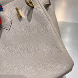 Polished bag shown from front angle