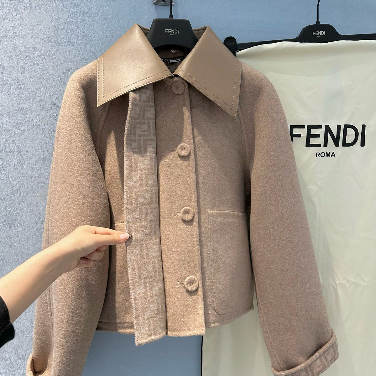Side profile of Fendi Coat showcasing structured silhouette
