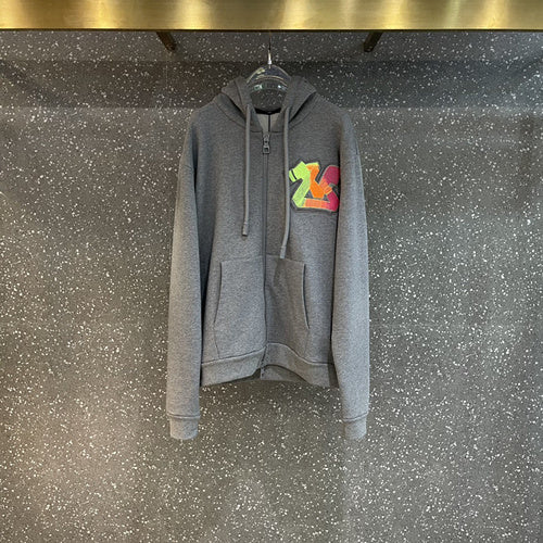 Full styled look of Louis Vuitton luxury clothing with label-forward styling