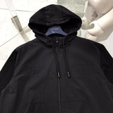 Back view of Louis Vuitton luxury clothing with signature branding