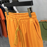 Front view of Rhude luxury clothing with label-forward styling