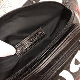Side profile of classic signature women's handbag – women's luxury handbag