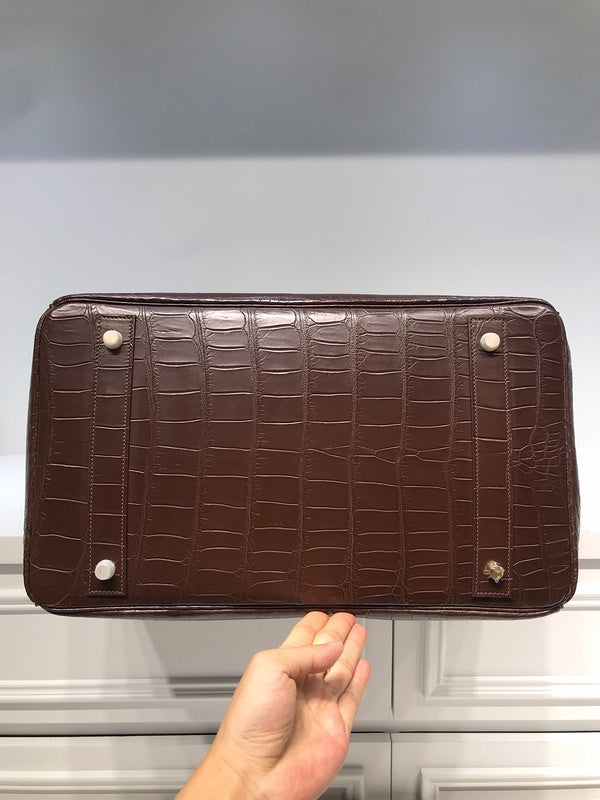 Side view of sophisticated structured handbag