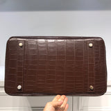 Side view of sophisticated structured handbag