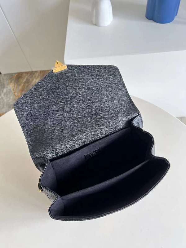 Styled lifestyle shot of modern elevated women's handbag – women's luxury accessory