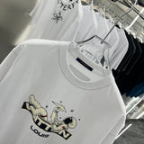 Close-up detail shot of Louis Vuitton cotton t-shirt with signature branding