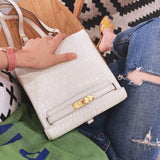 Side view of sculpted structured handbag