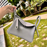 Side view of minimalist structured handbag
