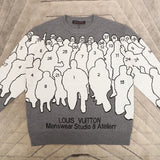 Flat lay presentation of Louis Vuitton luxury clothing with logo-detail design