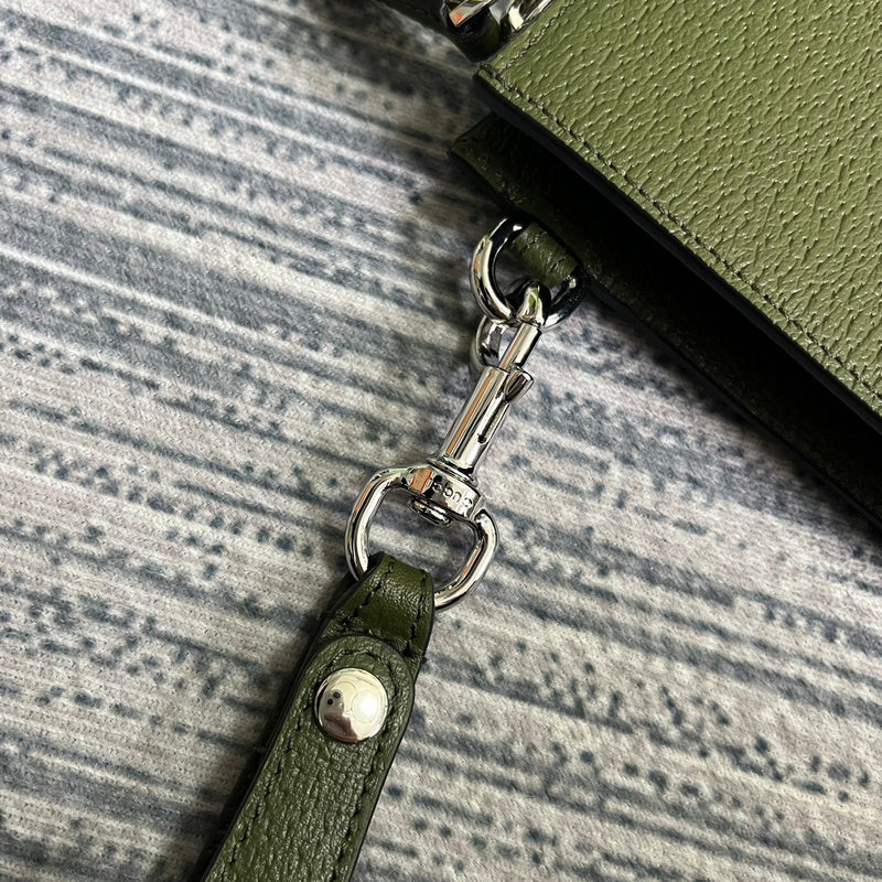 Handle and strap detail of structured everyday-luxe women's handbag – women's statement bag