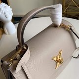 Handle and strap detail of modern sleek women's handbag – women's statement bag
